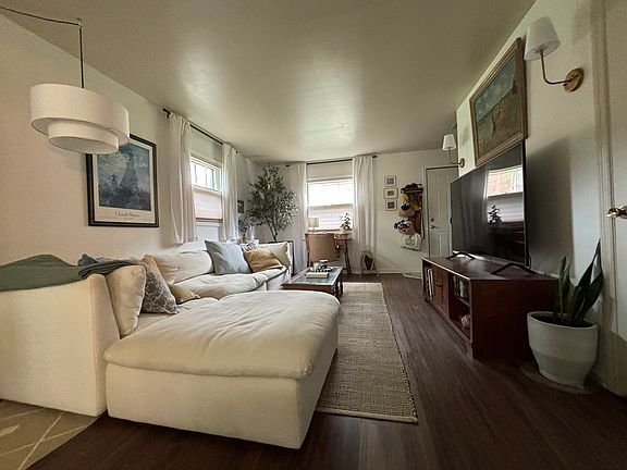 Open concept living room leads into dining area