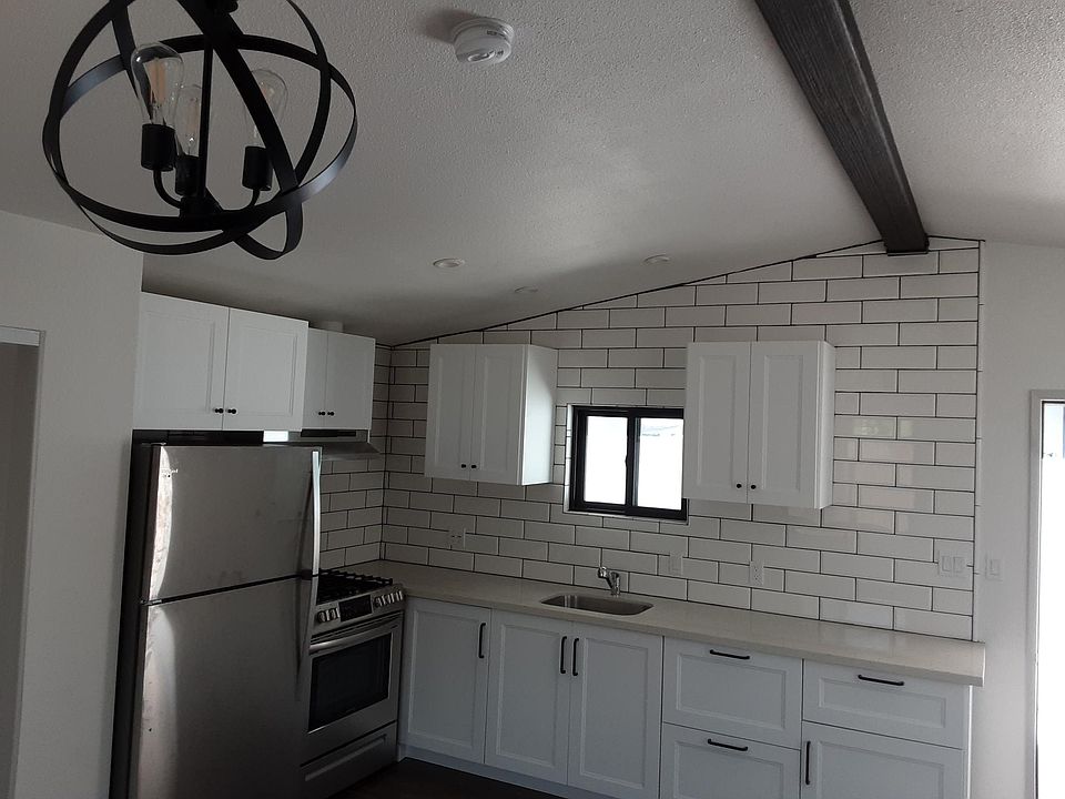 Kitchen View; White Cabinets & Quartz