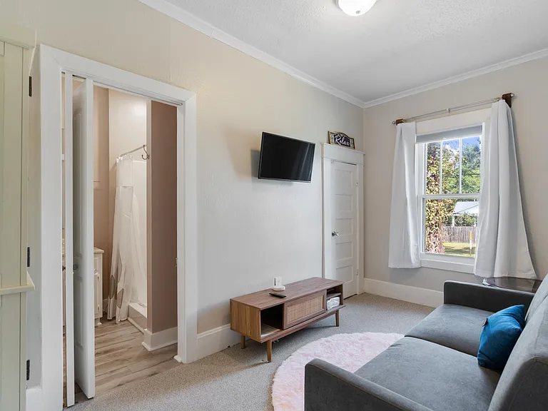 master sitting area with smart tv and futon