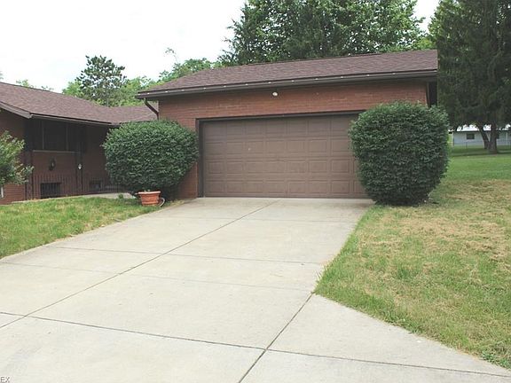Two car garage with covered walkway to home