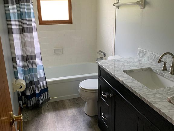 All three bathrooms have new vanities with Carara marble tops and new flooring