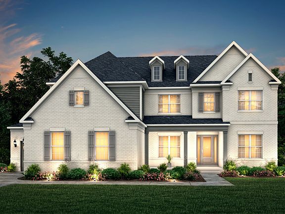 Sutton Exterior 16 features brick, covered front porch and 3 car sideload garage