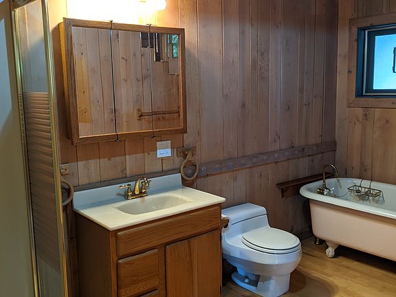 Downstairs farmhouse bath with clawfoot bathtub