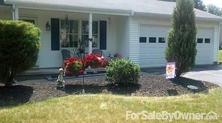 Front porch..attached double car garage
						:
						New garage doors less than 1 year old.