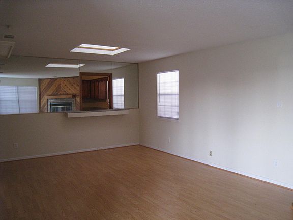 UPSTAIRS: Dining area under Skylight, facing Kitchen pass-thru window