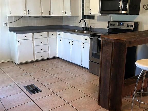 Great open kitchen area with eat in dining area.