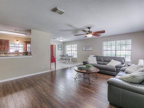 Wonderful family room with beautiful laminate wood flooring and plenty of natural light.