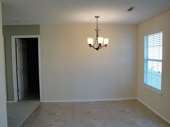 Sunny dining area adjacent to the living room and kitchen