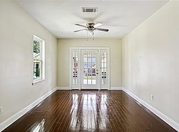 Spacious living/dining area with beautiful hardwood floors.
