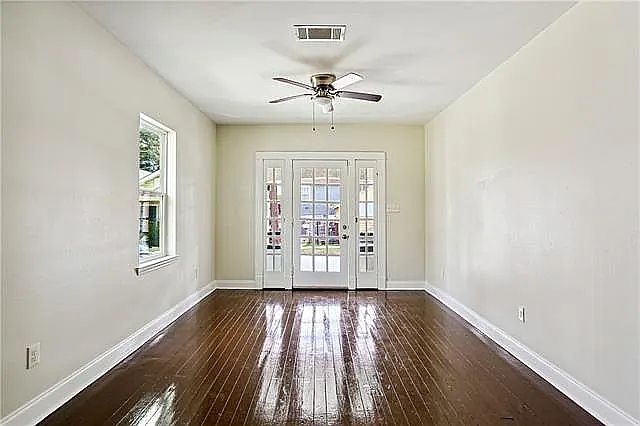 Spacious living/dining area with beautiful hardwood floors.