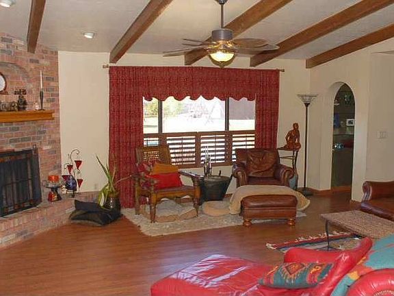 Family Room with wood flooring and cozy fireplace