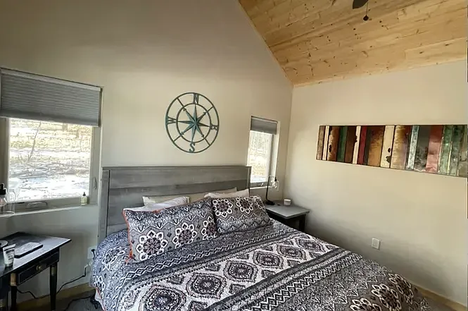 spacious master with king size bed & en suite bath w/ shower & free standing tub