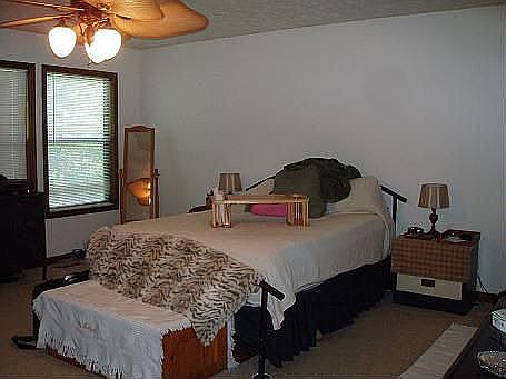 Master suite features large sitting area and his and hers closets.