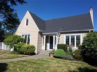 Driveway to the left leads to a detached garage with its own shed.