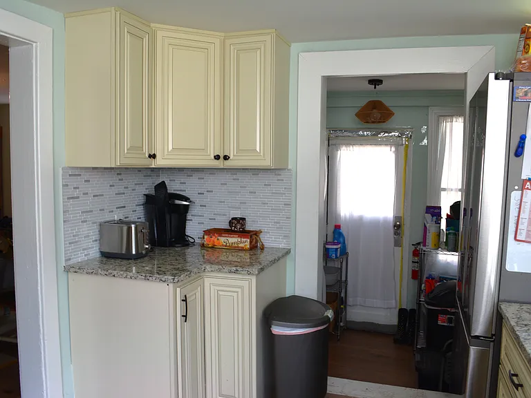 Laundry room with full size stackable washer and dryer included