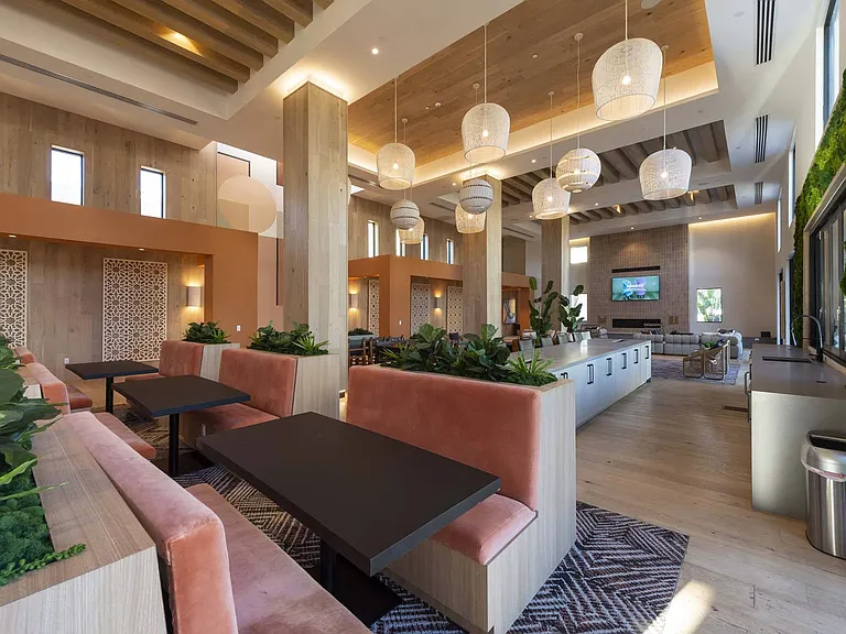 Gather and connect in our vibrant community clubroom, designed for both relaxation and entertainment.