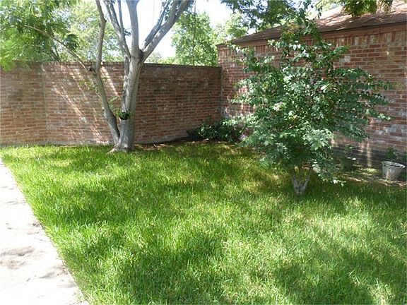 This home features a fabulous, closed-off front yard that your family will love!