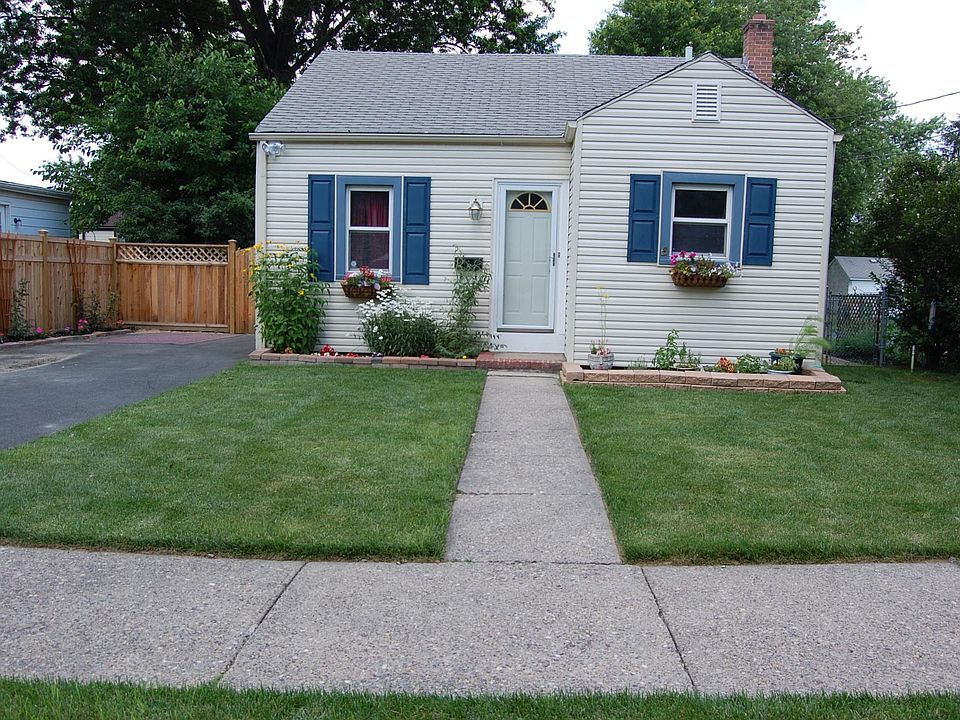 Asphalt driveway holds 2 cars, parking in front