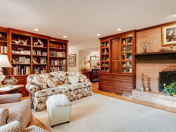 Custom built book shelves and cabinetry.  Fireplace has gas logs.