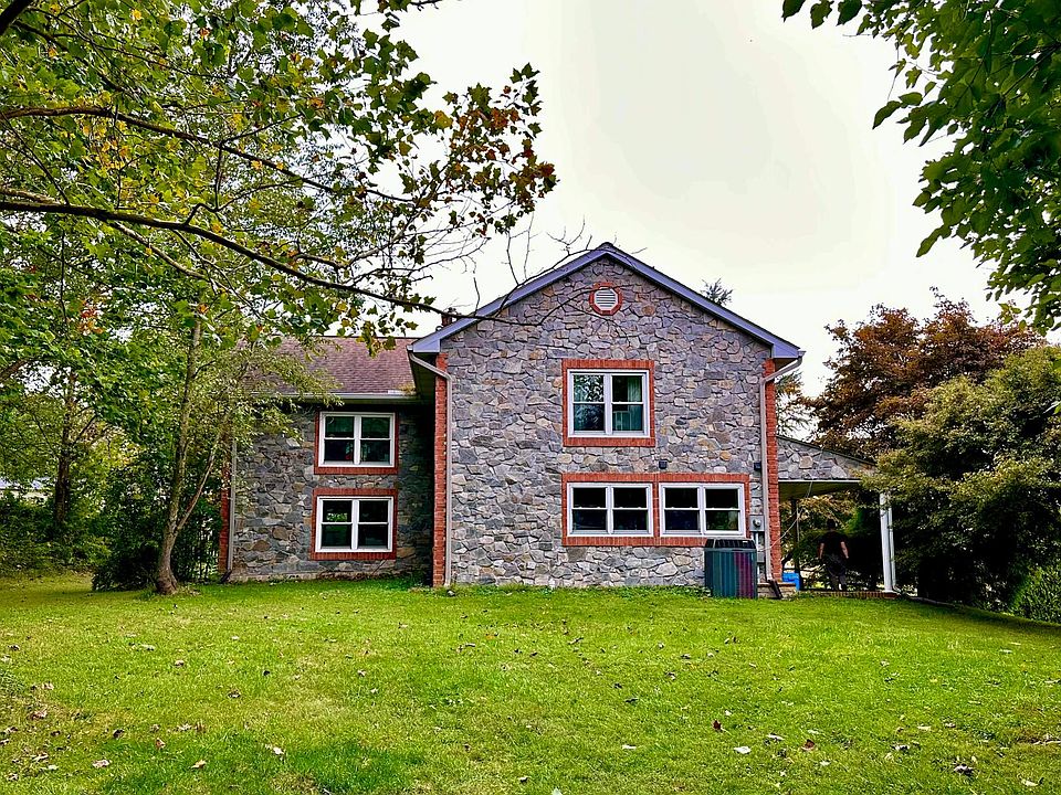 Natural stone with many large windows