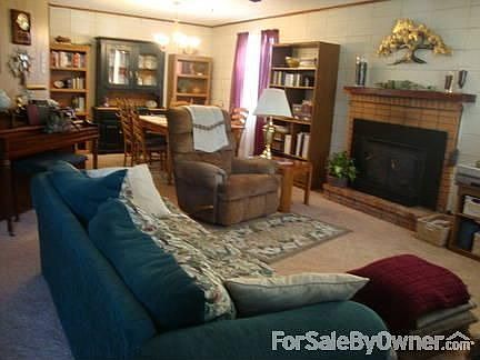 living room/dining room
						:
						with wood burning fireplace