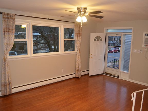 Top front entrance view into the living room from the dining room area