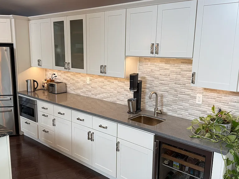 Kitchen including drawer microwave and coffee bar