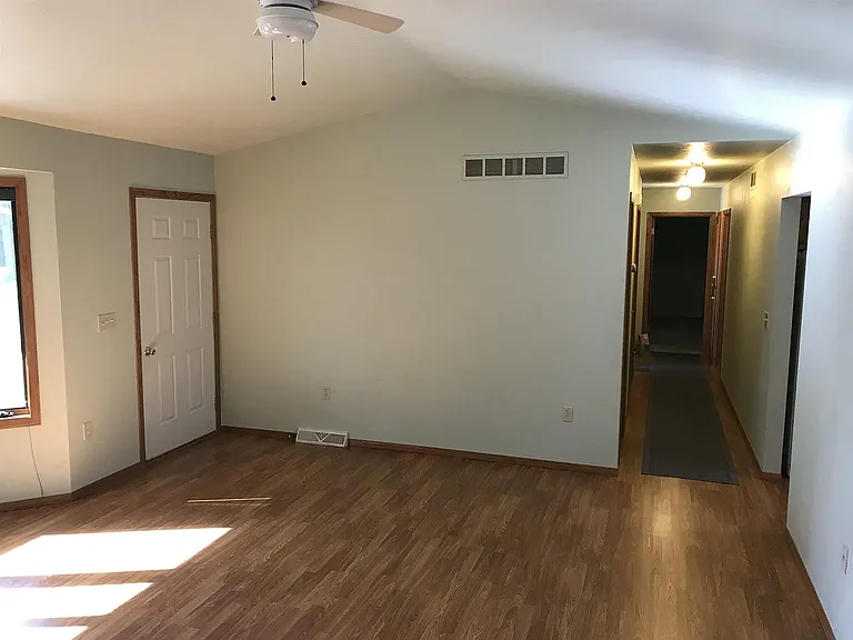 Hallway to bedrooms and bathrooms from living room.