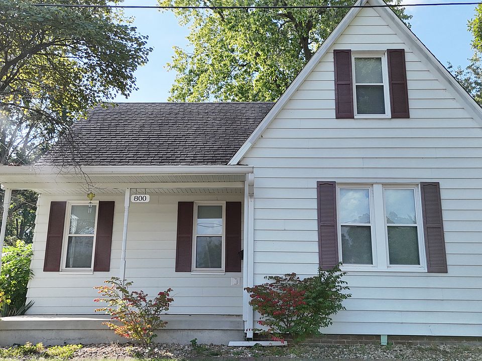 Front of house has a sitting porch