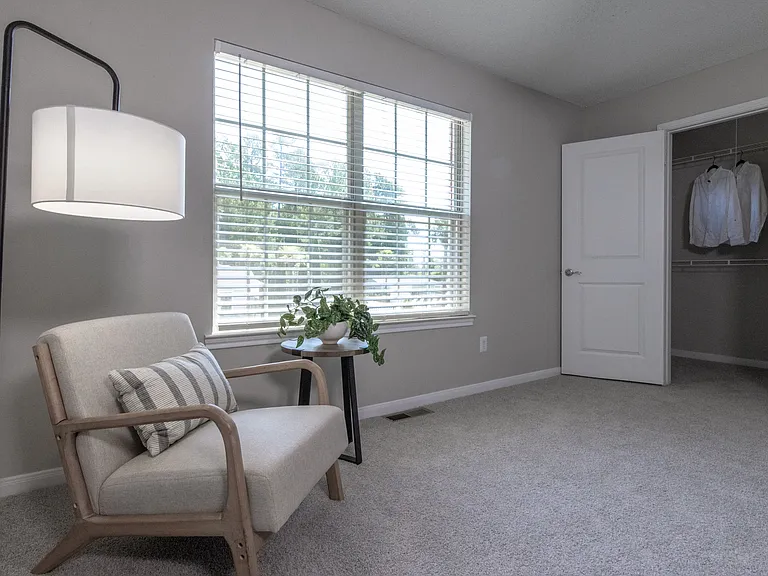 The second bedroom offers ultimate privacy, complete with its 'mini' walk-in closet.