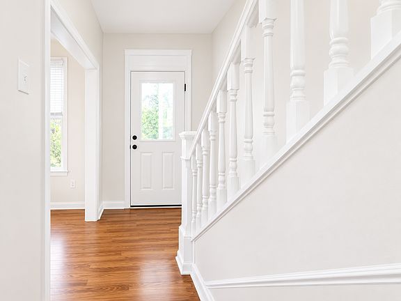 Bright modern foyer with staircase