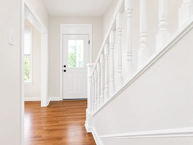 Bright modern foyer with staircase