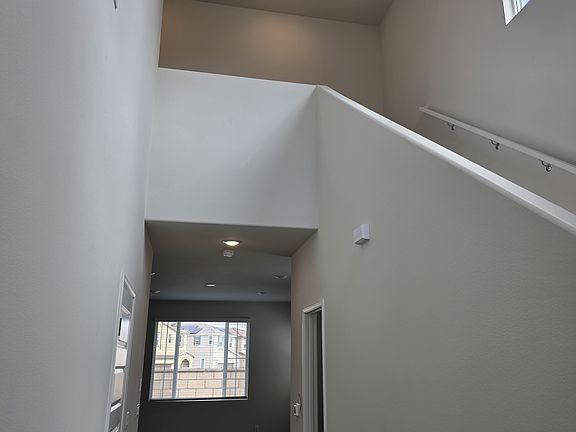 View when entering from main door. Foyer, Vaulted ceiling, Large glass windows for plenty of light