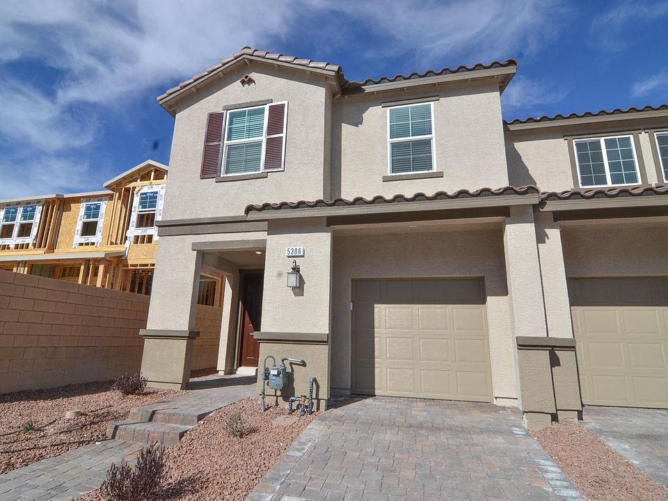 Front of the townhome with 1 car attached garage