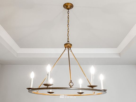 Tustin plan 4358 SF plan on Lot 8 is Under Construction with an end of Dec. completion.  Photos are of a different plan, but the similar colors and finishes are representative of the homes at Clyde Estates. The photo is an example of the (optional) brass light fixture in Formal Dining room. There is no crown molding in the Formal Dining of the Tustin plan.  Color, design, details and finishes are subject to change.