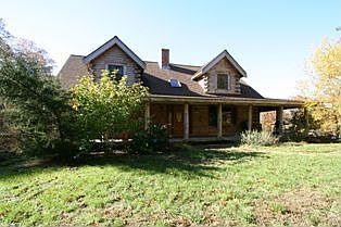 Front of Home, facing East, wrap-around Porch