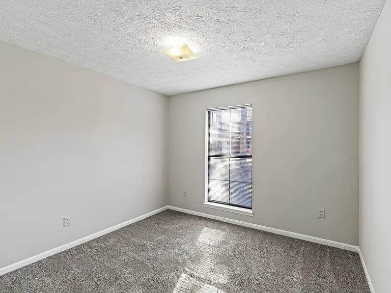 Our Montgomery apartments at Stratford Village offer peaceful bedrooms with plush carpeting and natural light, professionally operated by Highlands Vista Group.