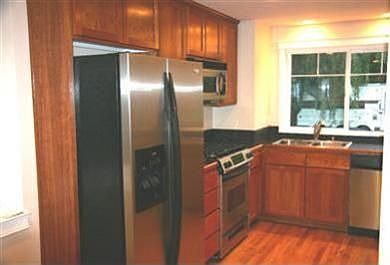 Kitchen with Whirlpool Gold stainless appliances