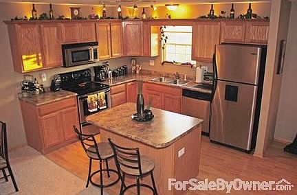 Kitchen
						:
						Features stainless steel applicances with accent lighting above the cupboards