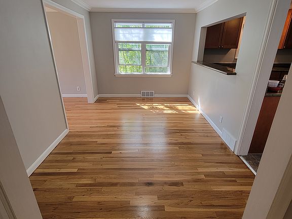 Open concept dinning room with passthrough view to kitchen