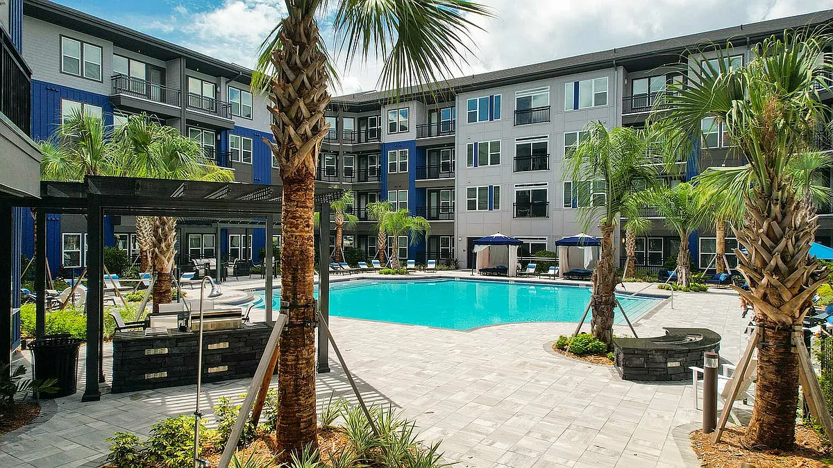 Relax in style at this luxurious apartment oasis, complete with a sparkling pool perfect for sunny days. - The Jack