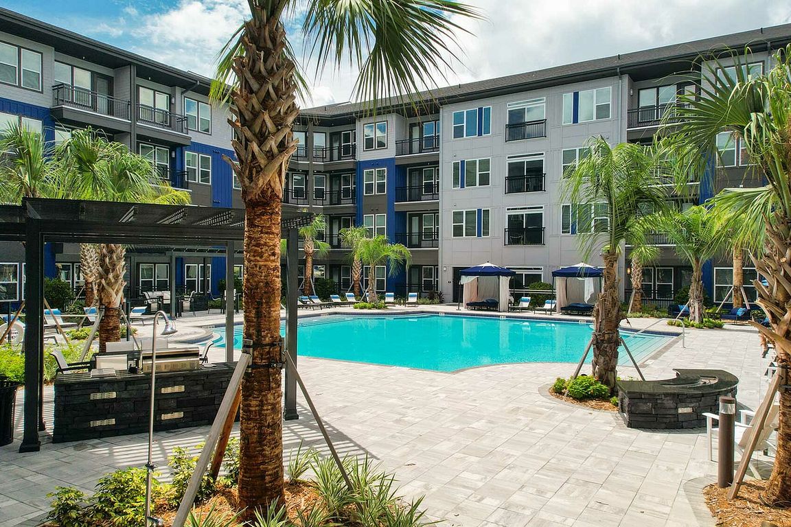 Relax in style at this luxurious apartment oasis, complete with a sparkling pool perfect for sunny days.