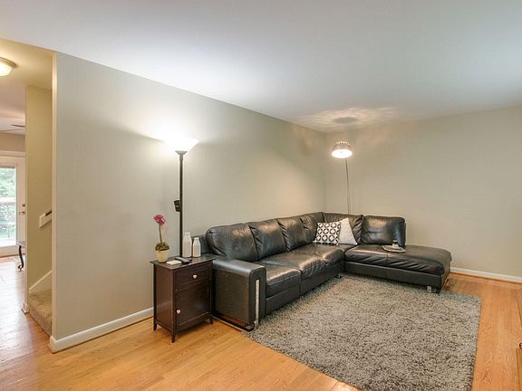 Living room, hardwood floors, hall to stairs, dining room an