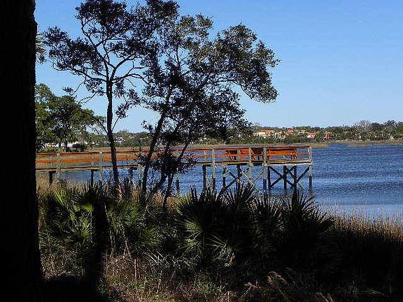 Fishing pier behind building