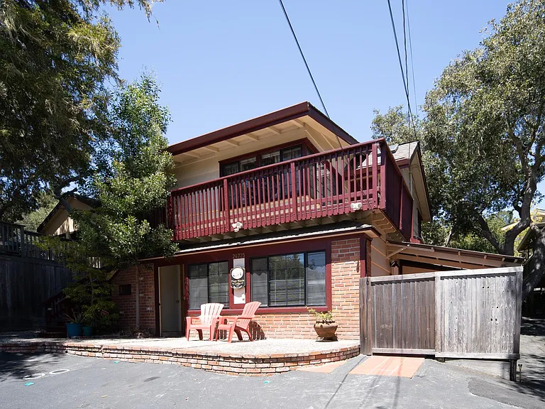 Front View of Triplex, parking in front, laundry to left.