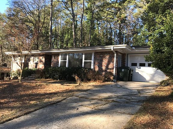 front of 4 sided brick house