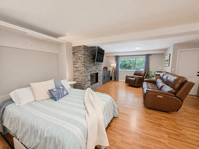 Family Room - Daylit Basement - Gas Fireplace - Large amount of Storage - Murphy Bed/Desk Office Area interchangeable - Adaptable for use as a Guest Suite with its own Bathroom.