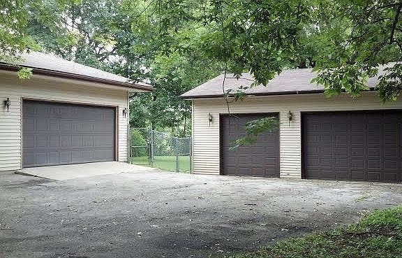 Attached garage with additional three car garage on circular