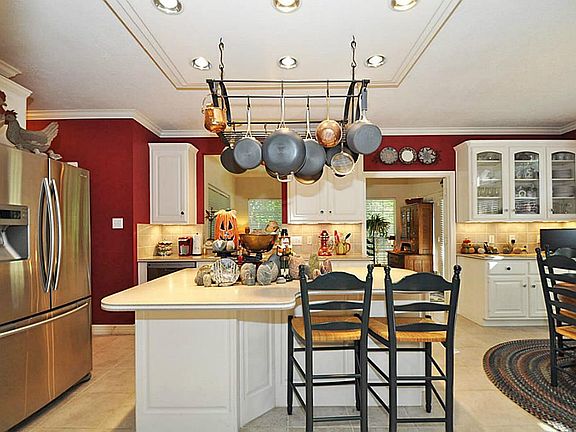 Large kitchen with solid surface counter tops.