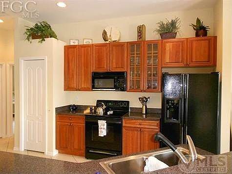 Kitchen w/ Raised panel solid 42" cabinets w/ glass fronts on 2 panels.